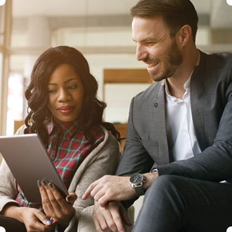 a girl with a man reading notes